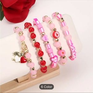 NWT 5 piece pink multi color layered bracelets